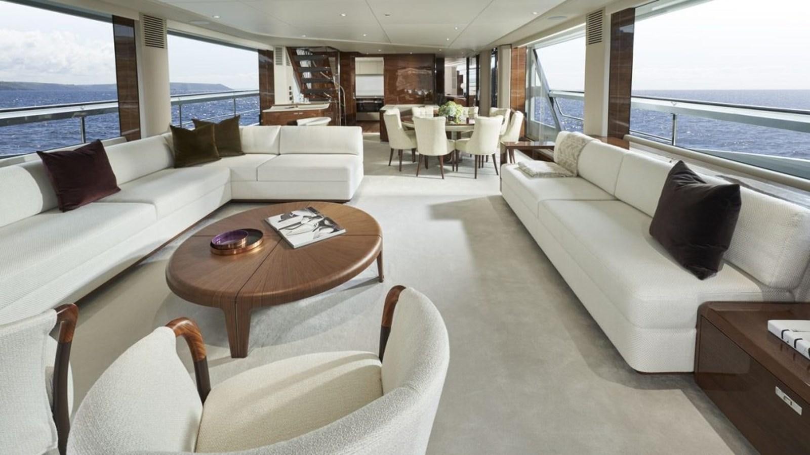 a living room with a couch and a table aboard PRINCESS X95/03 Yacht for Sale