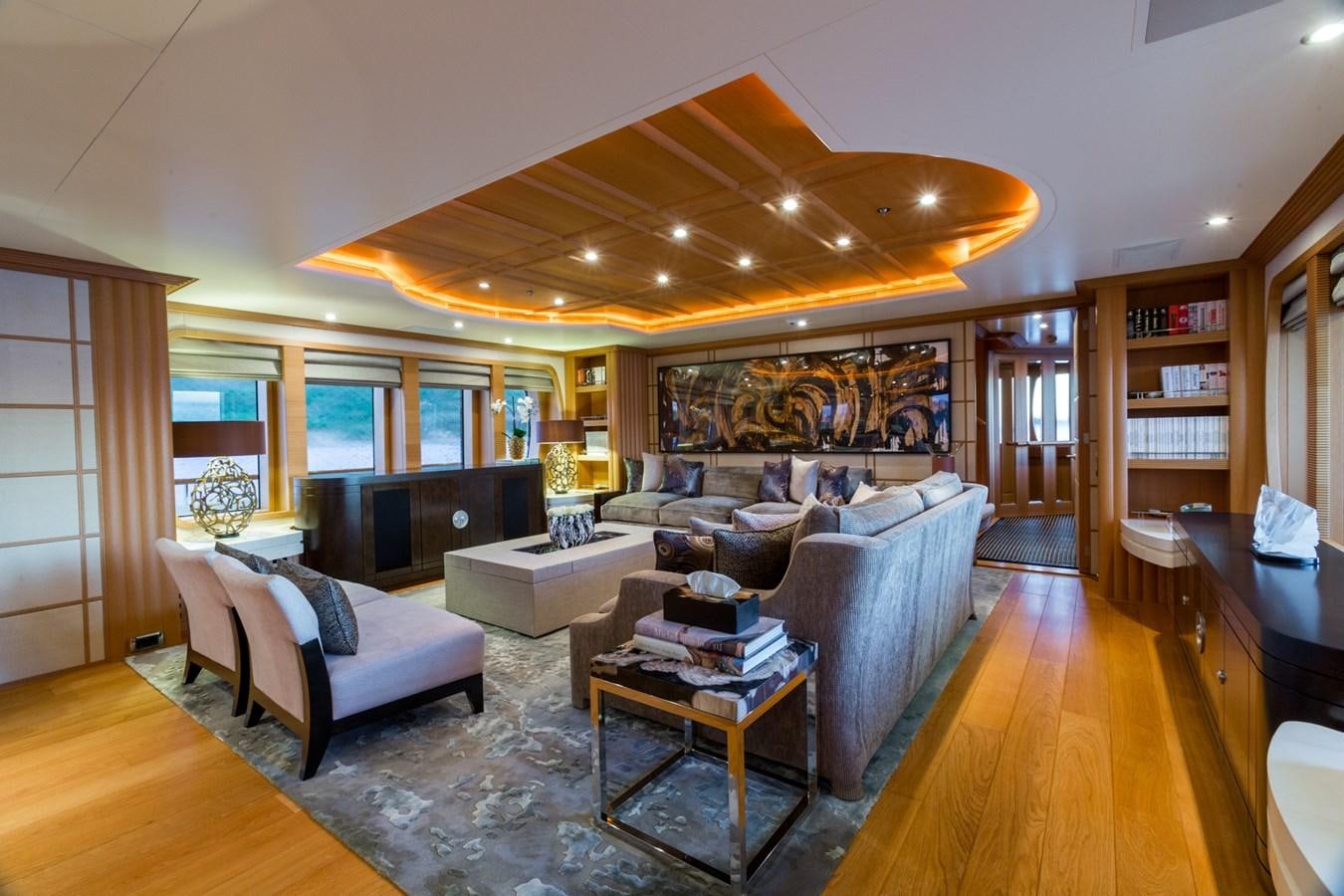 a living room with a wood floor aboard ADVENTURE Yacht for Sale