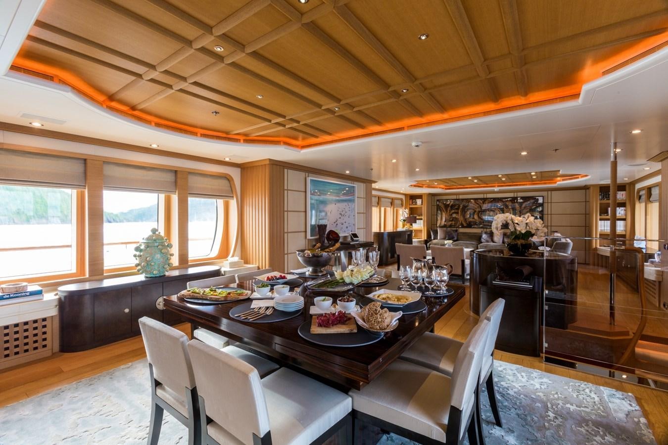 a large dining room with a table and chairs aboard ADVENTURE Yacht for Sale