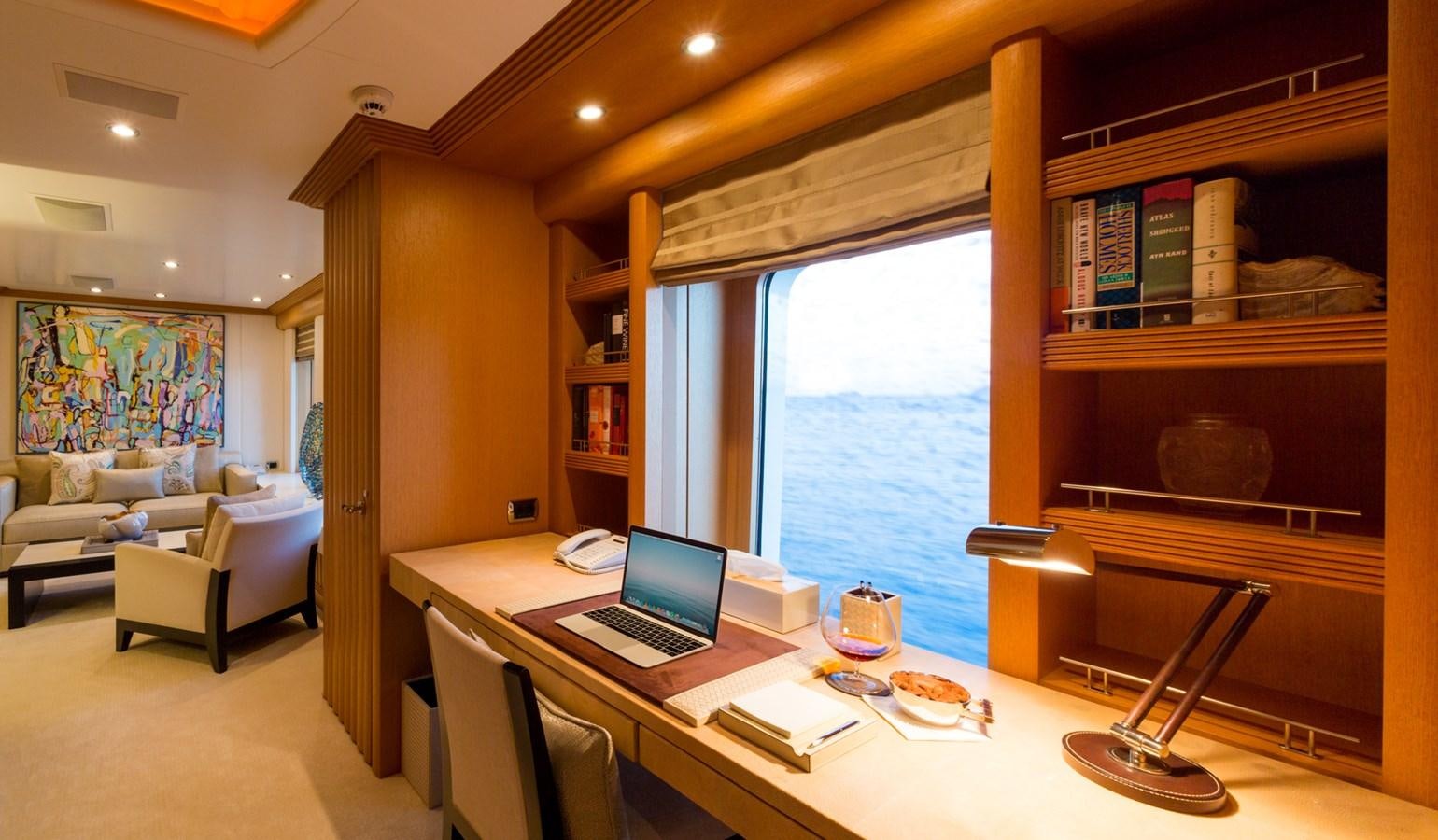 a room with a desk and a laptop aboard ADVENTURE Yacht for Sale