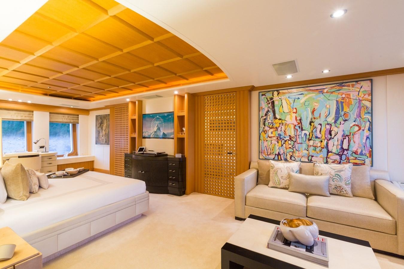 a living room with a large screen aboard ADVENTURE Yacht for Sale