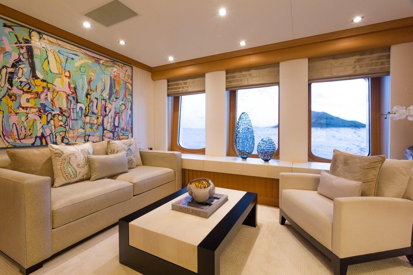 a living room with a painting aboard ADVENTURE Yacht for Sale