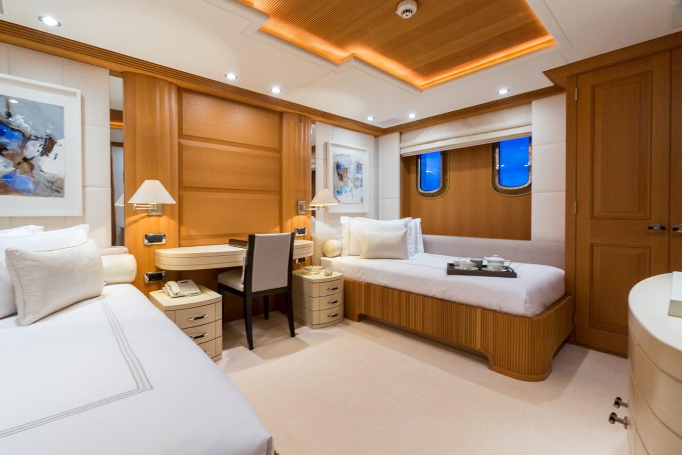 a room with a bed and a desk aboard ADVENTURE Yacht for Sale