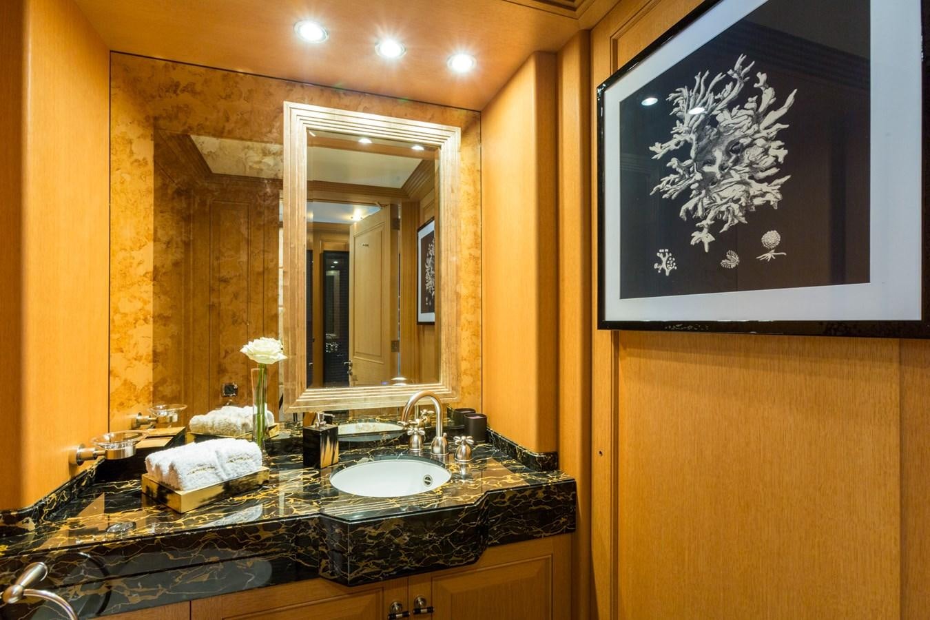 a bathroom with a large mirror aboard ADVENTURE Yacht for Sale