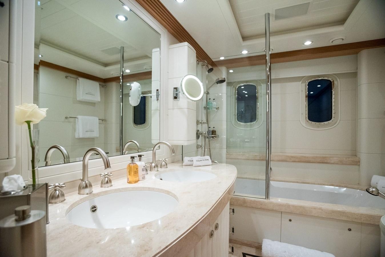 a bathroom with a large mirror aboard ADVENTURE Yacht for Sale