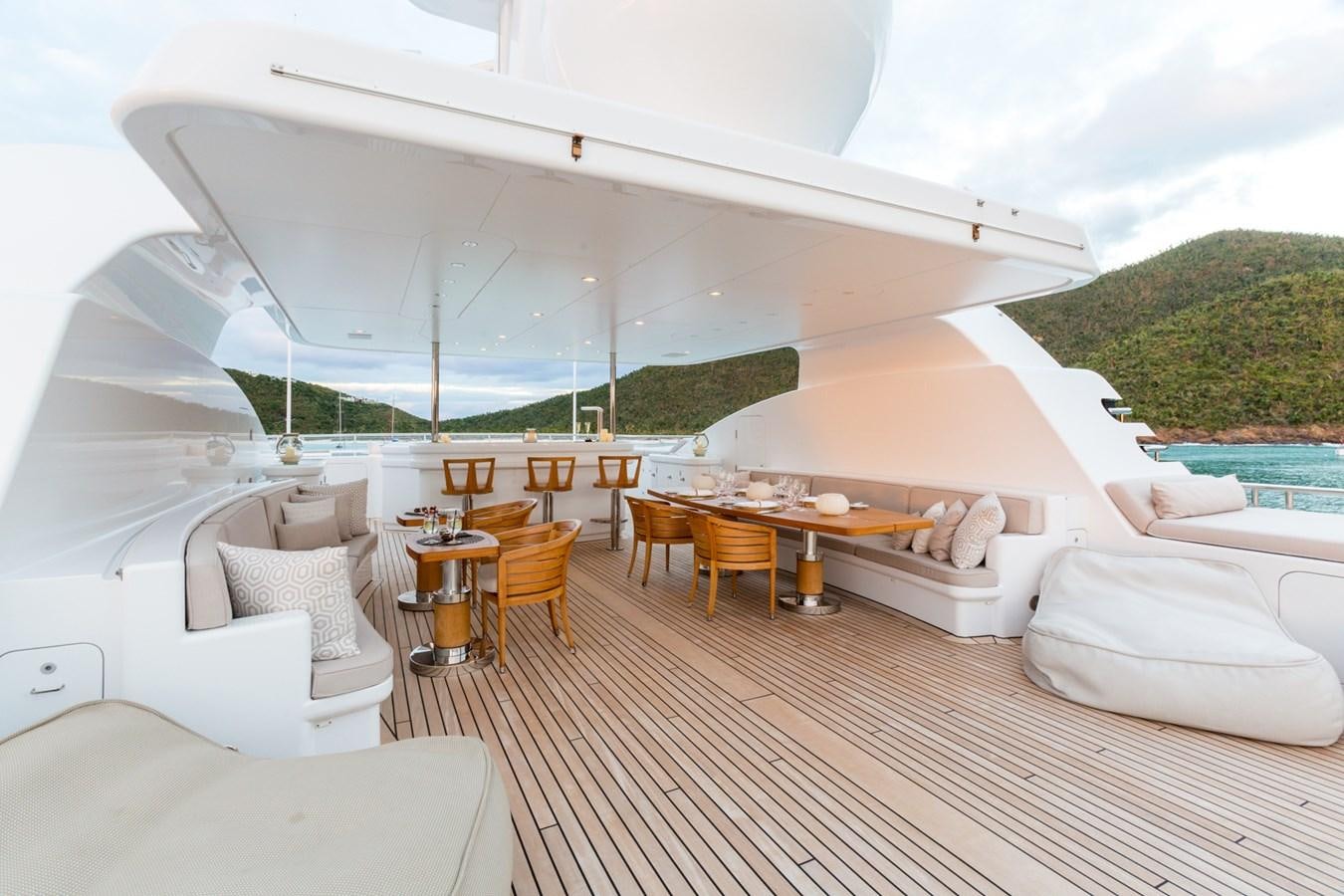 a room with a table and chairs aboard ADVENTURE Yacht for Sale