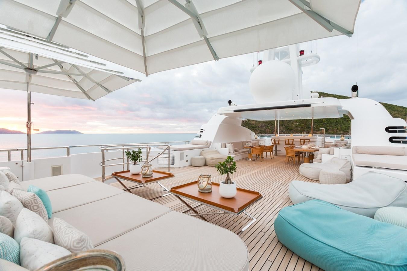 a large white tent with a table and chairs in it aboard ADVENTURE Yacht for Sale