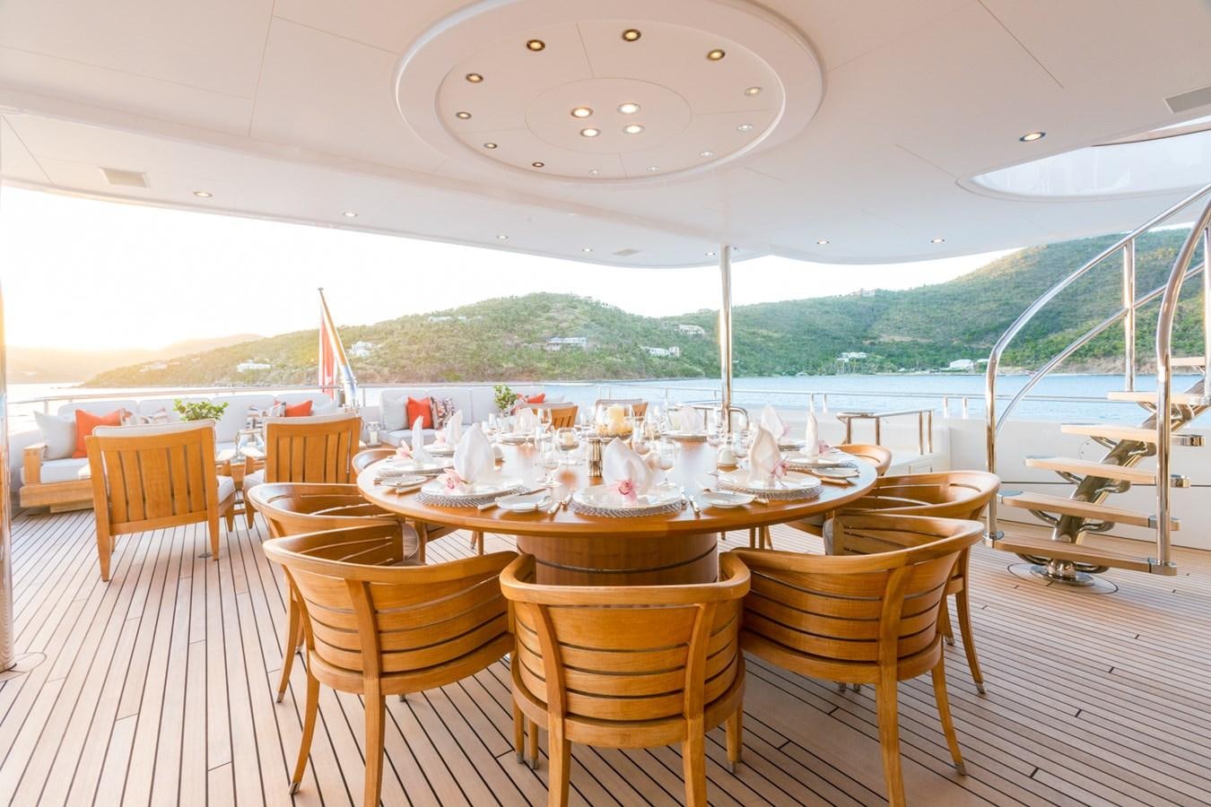 a table set for a dinner party aboard ADVENTURE Yacht for Sale