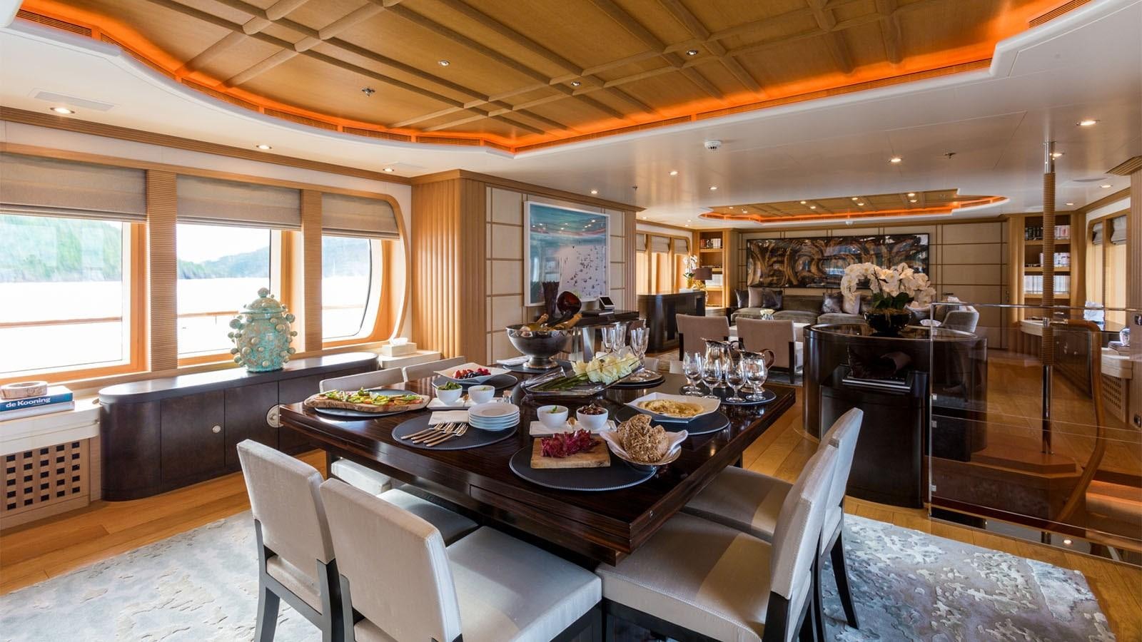 a dining room with a table set aboard ADVENTURE Yacht for Charter