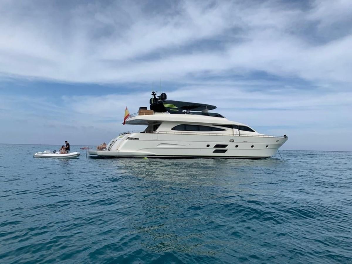 a white yacht in the water aboard LIBERATA Yacht for Sale