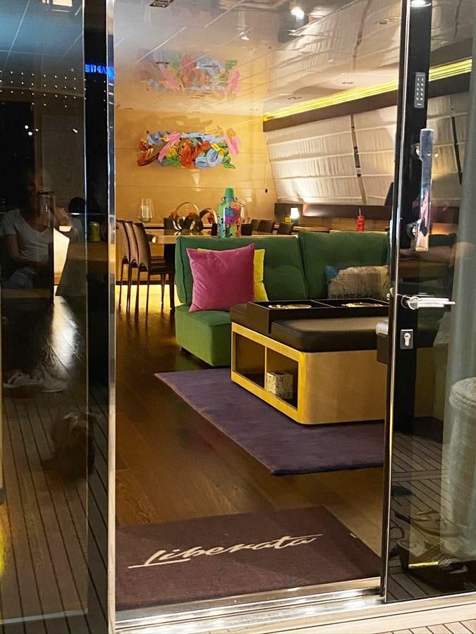 a room with a couch and a table aboard LIBERATA Yacht for Sale
