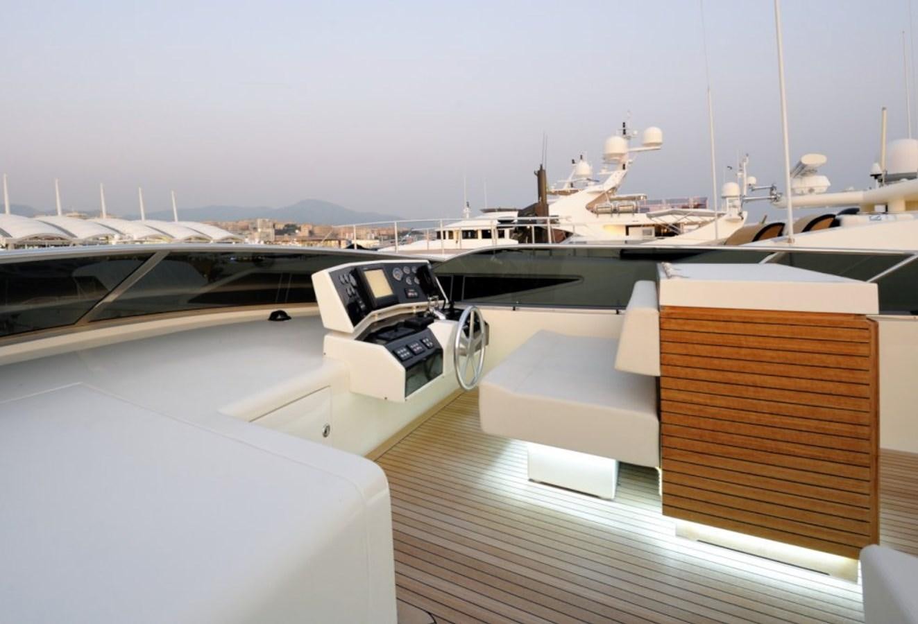 a deck with a railing and a view of a city aboard LIBERATA Yacht for Sale