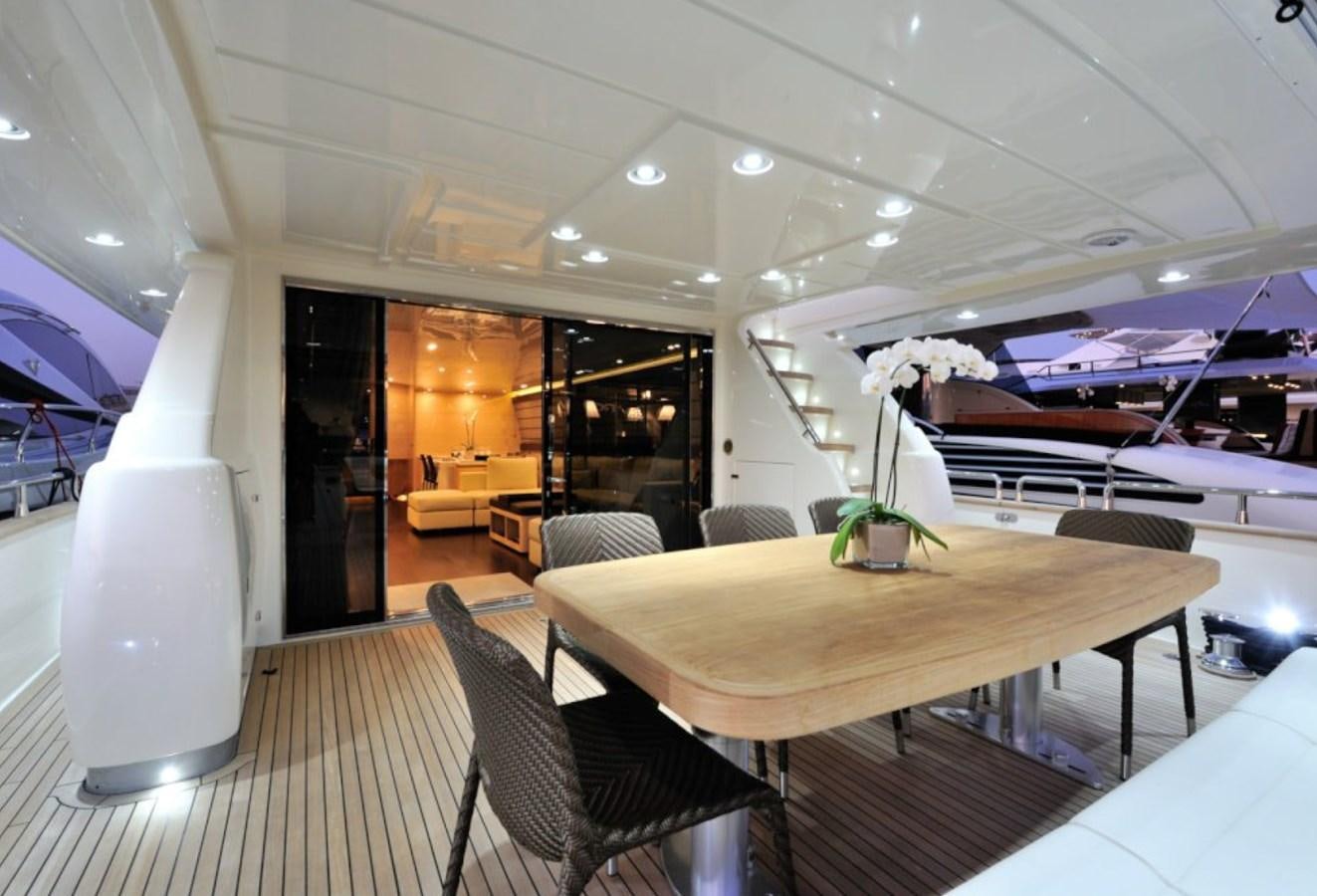 a room with a table and chairs aboard LIBERATA Yacht for Sale