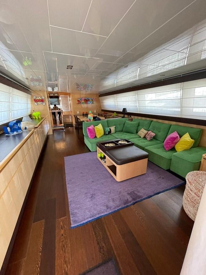 a living room with a couch aboard LIBERATA Yacht for Sale