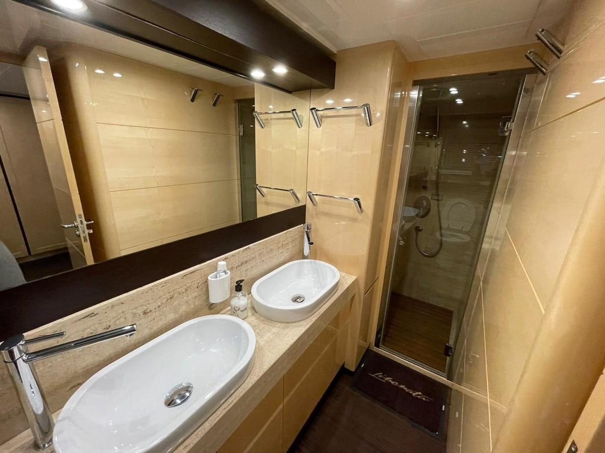 a bathroom with two sinks aboard LIBERATA Yacht for Sale
