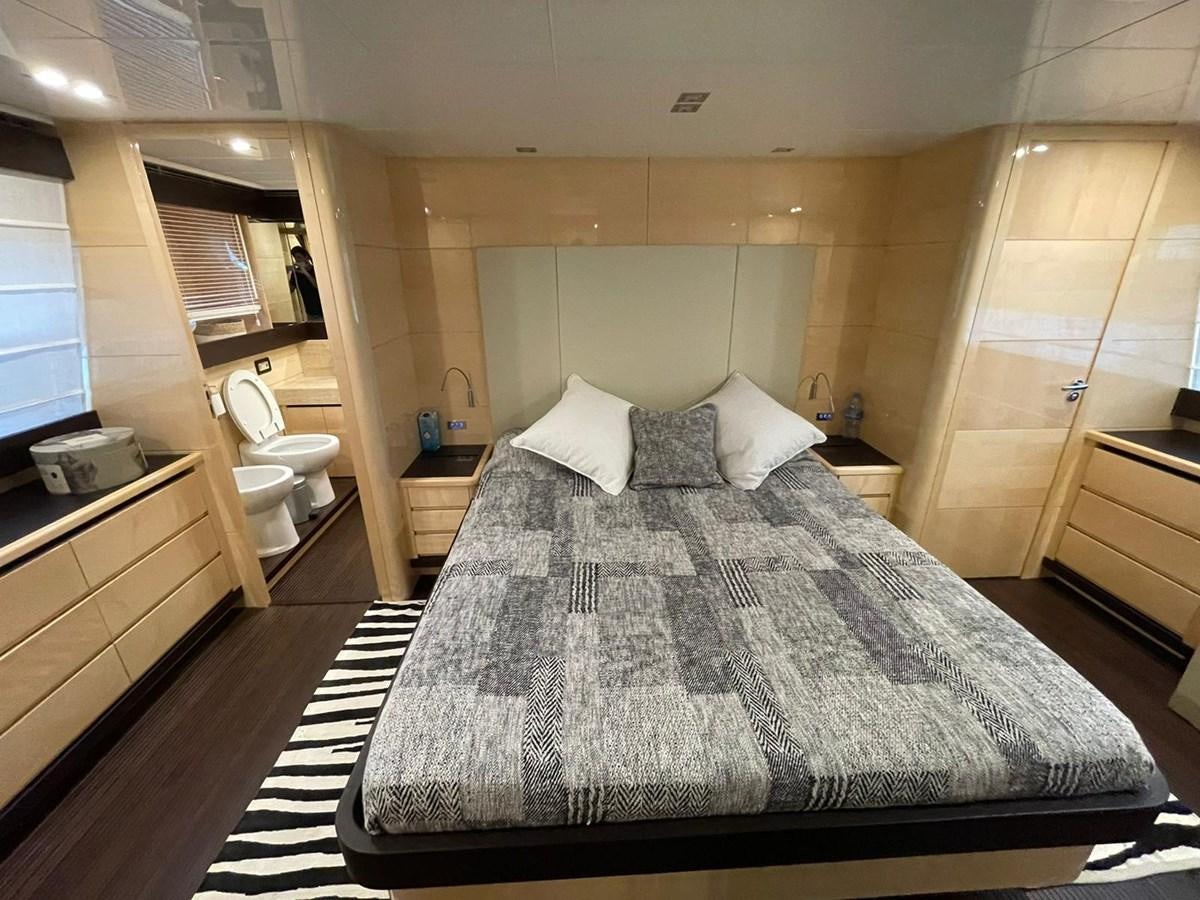 a large bedroom with a large bed aboard LIBERATA Yacht for Sale