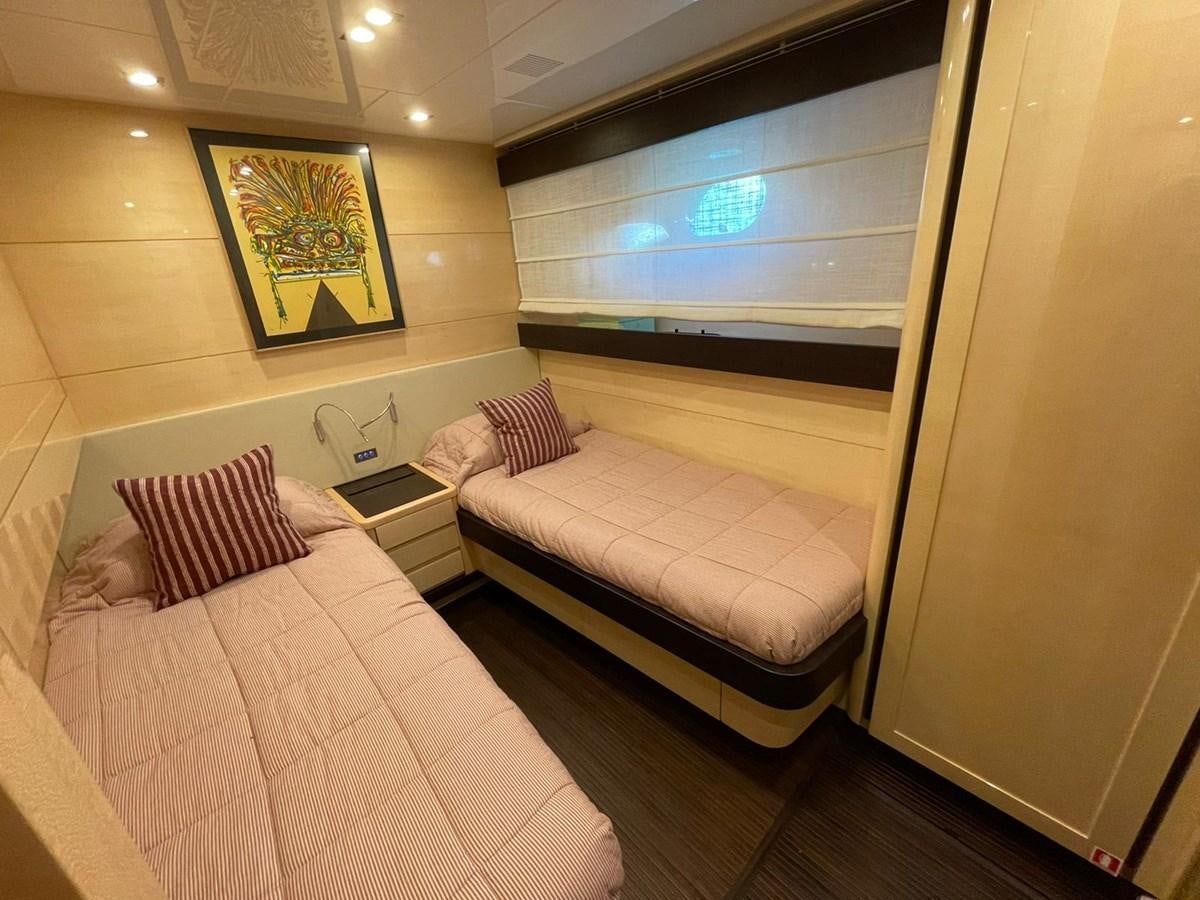 a room with a bed and a window aboard LIBERATA Yacht for Sale