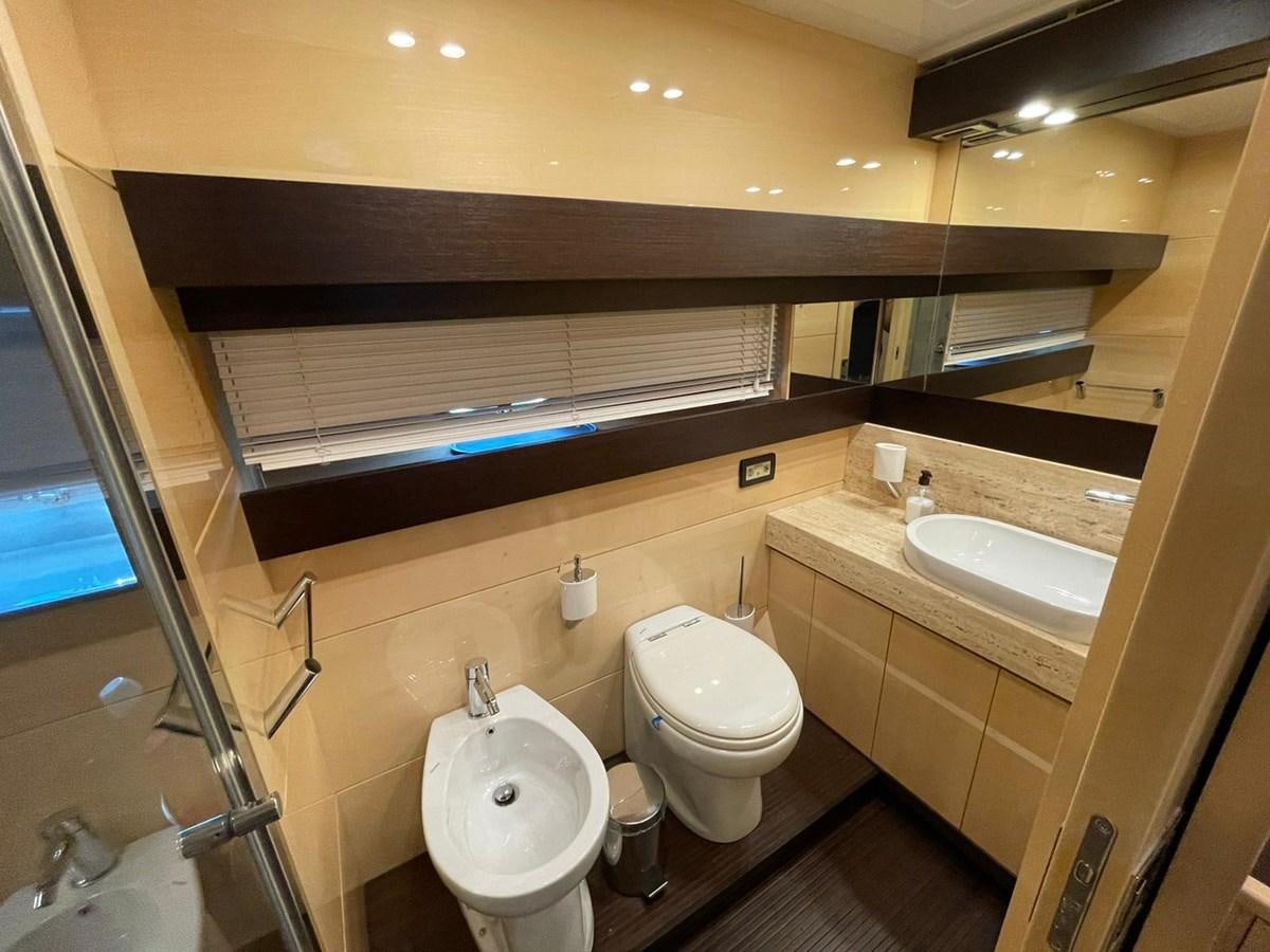 a bathroom with a toilet and sink aboard LIBERATA Yacht for Sale