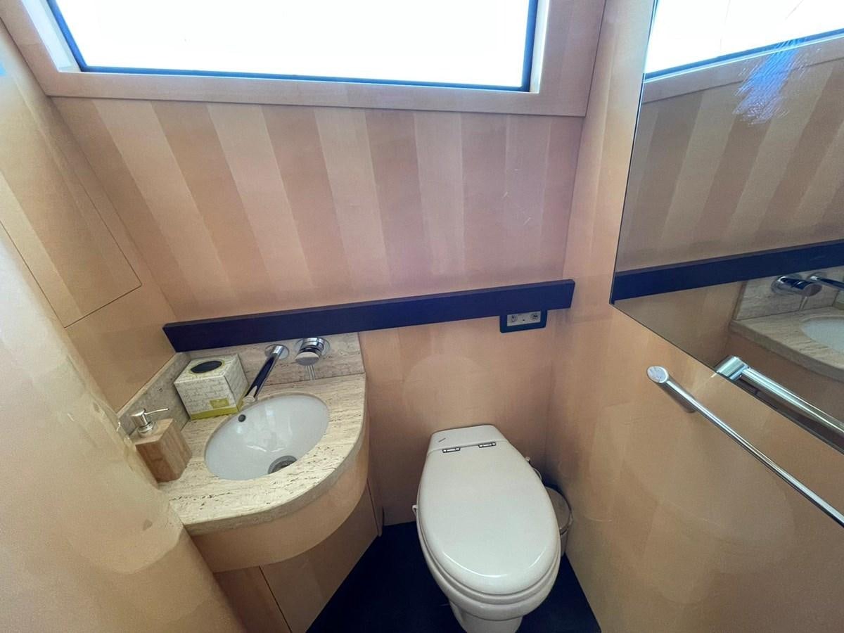 a small bathroom with a toilet aboard LIBERATA Yacht for Sale