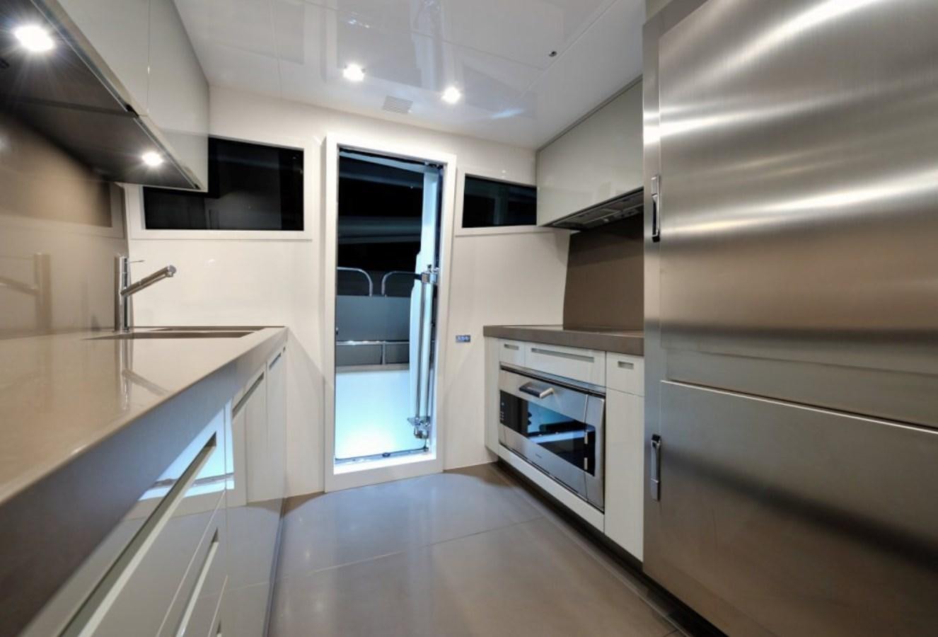 a kitchen with a stove and cabinets aboard LIBERATA Yacht for Sale