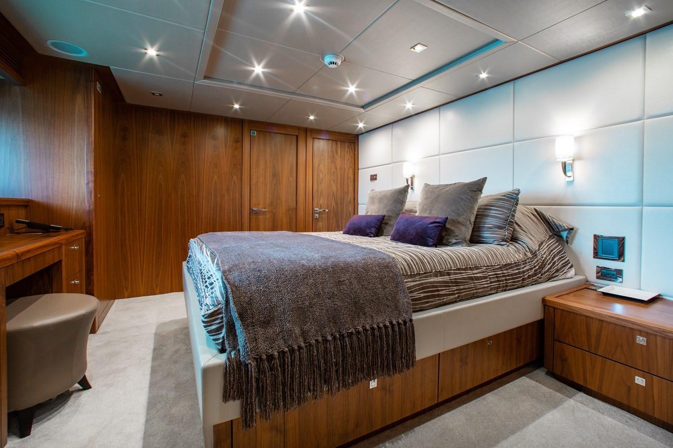a room with a bed and a chair aboard MARIN Yacht for Sale