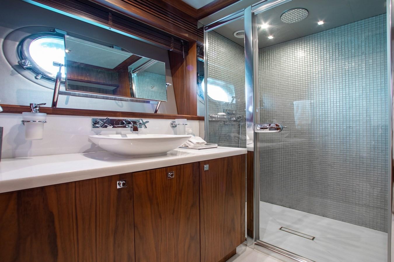 a bathroom with a large mirror aboard MARIN Yacht for Sale