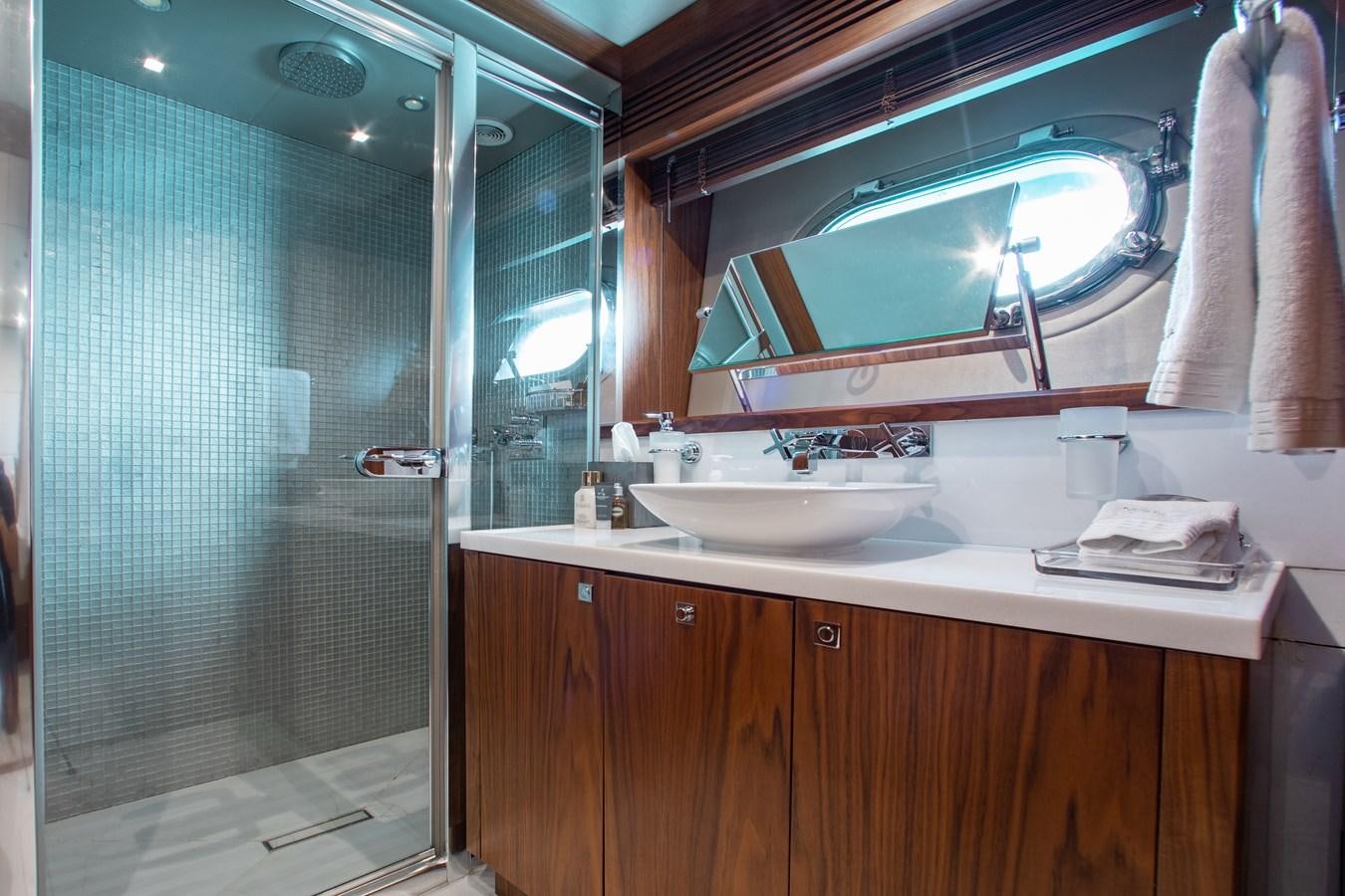 a bathroom with a large mirror aboard MARIN Yacht for Sale