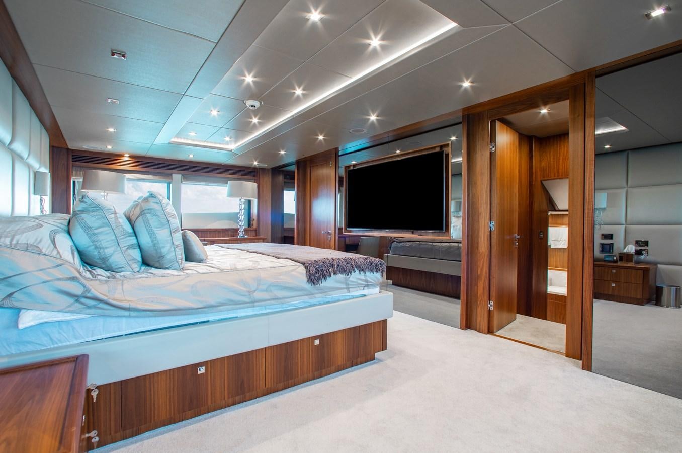 a room with a bed and a television aboard MARIN Yacht for Sale