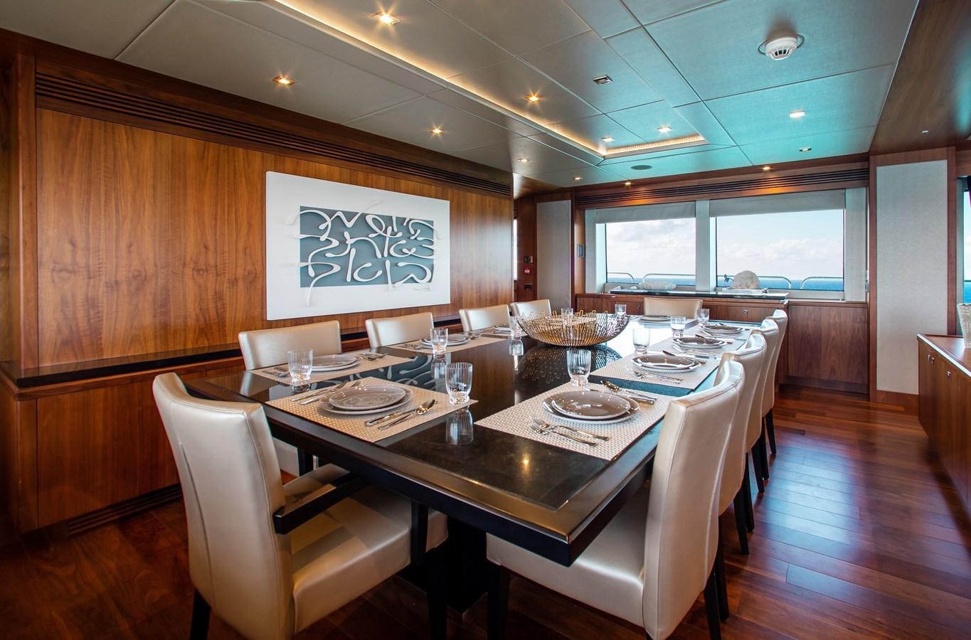 a large dining table in a room aboard MARIN Yacht for Sale