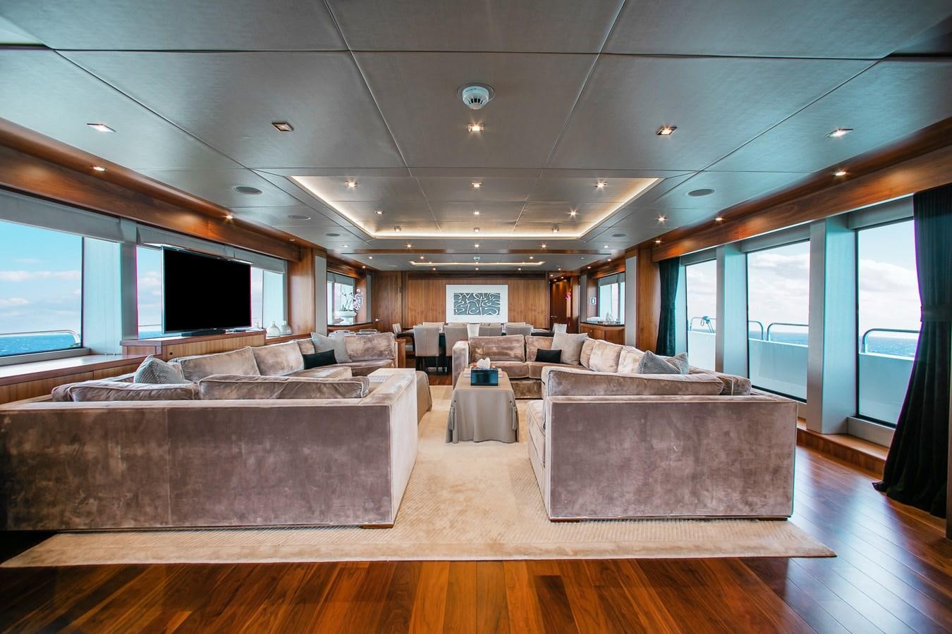 a living room with a large couch aboard MARIN Yacht for Sale