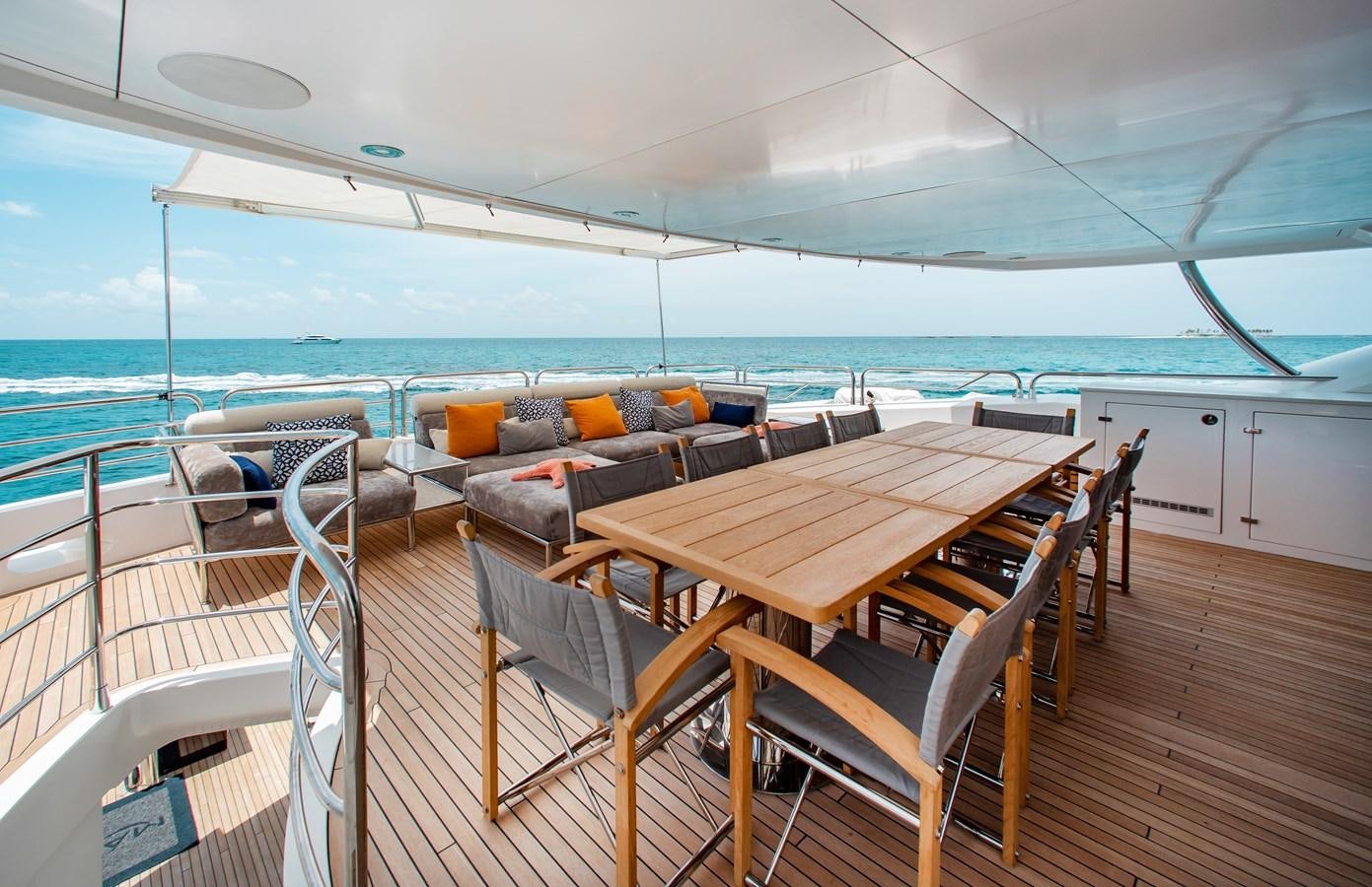 a deck with chairs and tables on it aboard MARIN Yacht for Sale