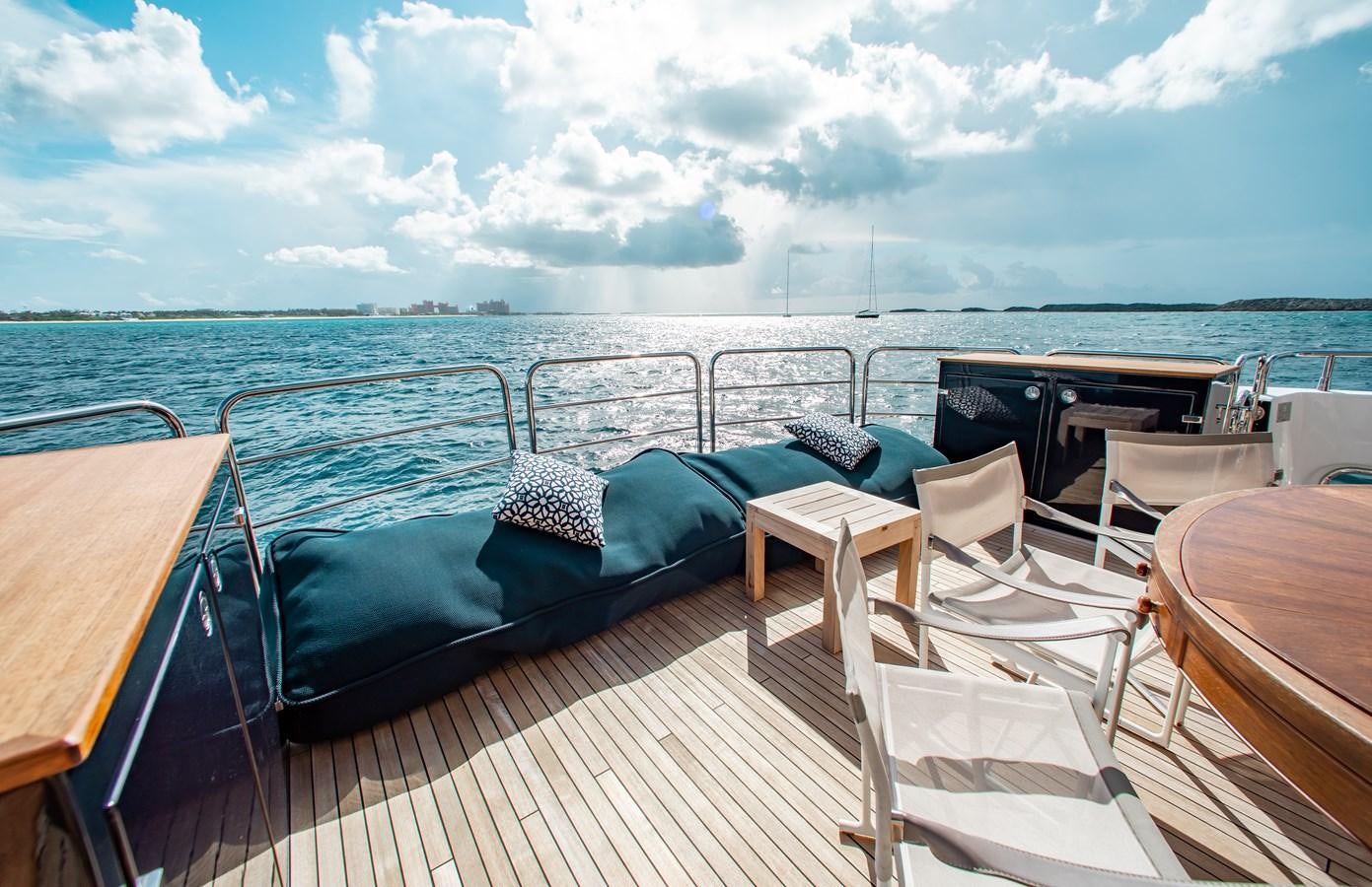 a deck with chairs and a bed aboard MARIN Yacht for Sale