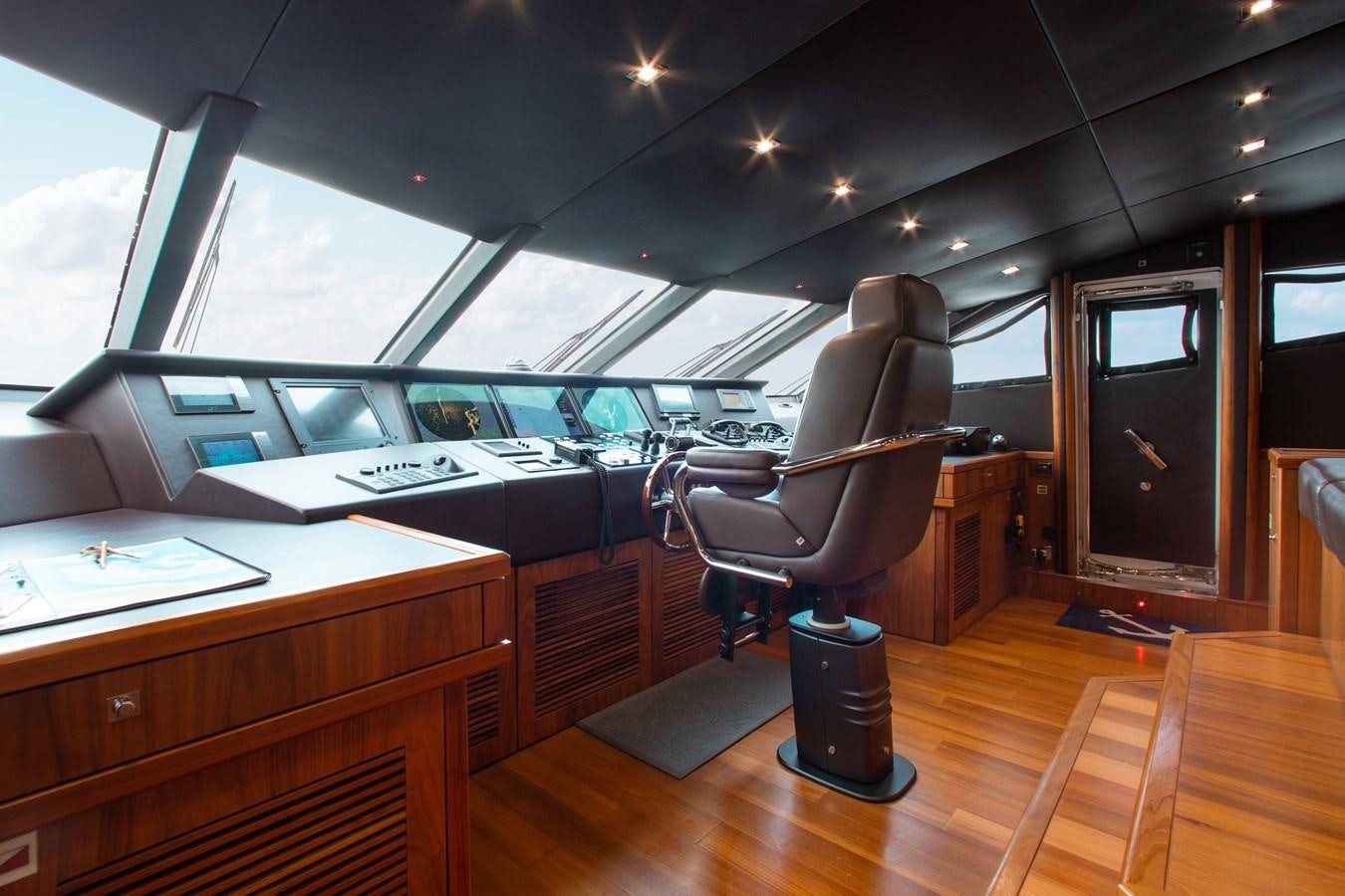 a room with a tv and a chair aboard MARIN Yacht for Sale