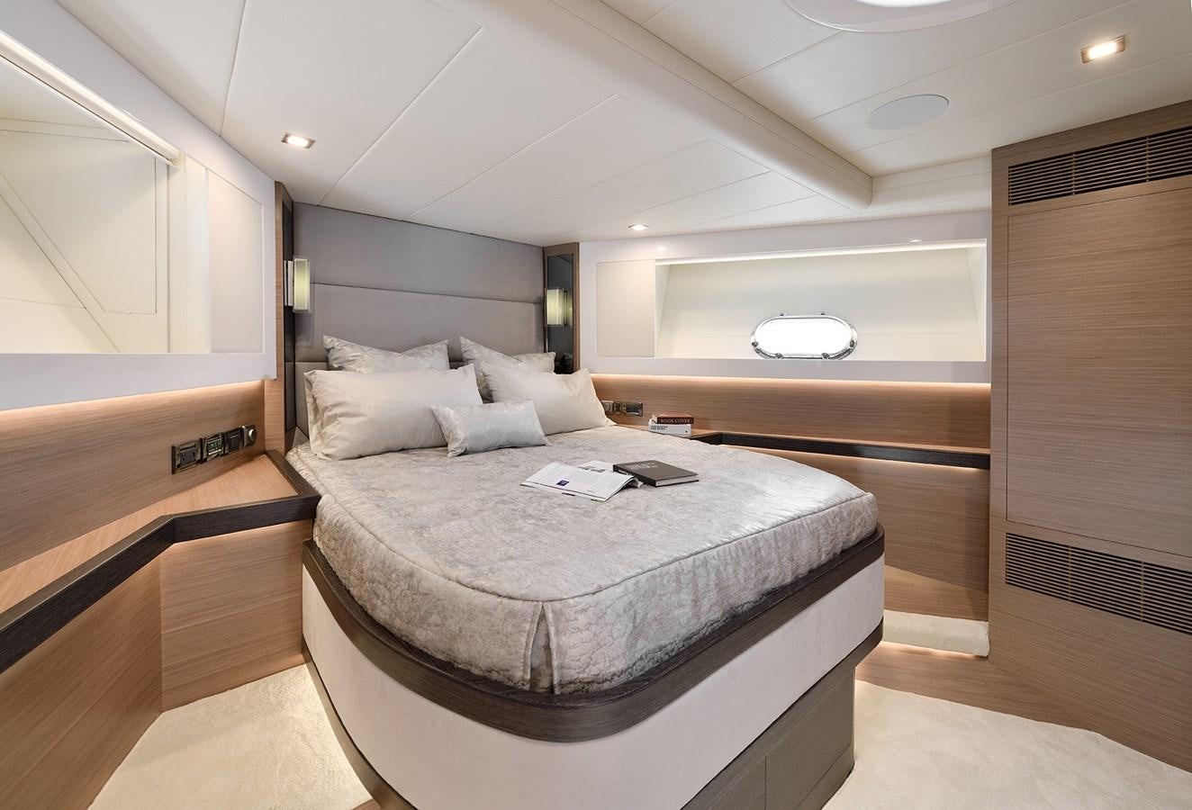 a large bedroom with a large bed aboard E81 Yacht for Sale