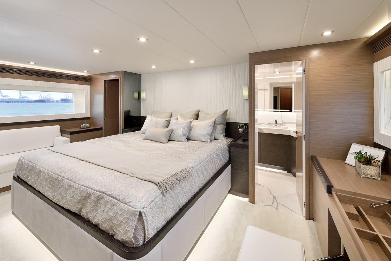 a large bedroom with a large bed aboard E81 Yacht for Sale