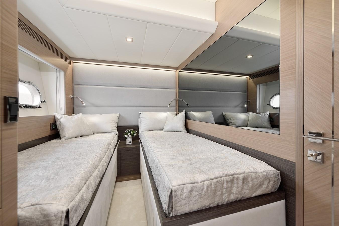 a bed in a room aboard E81 Yacht for Sale