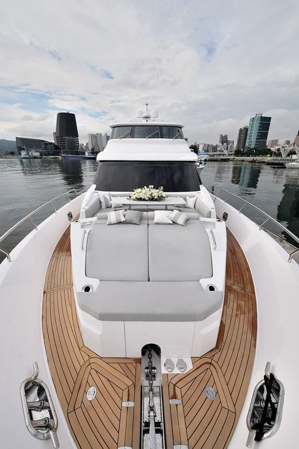 a white boat with flowers on it aboard E81 Yacht for Sale