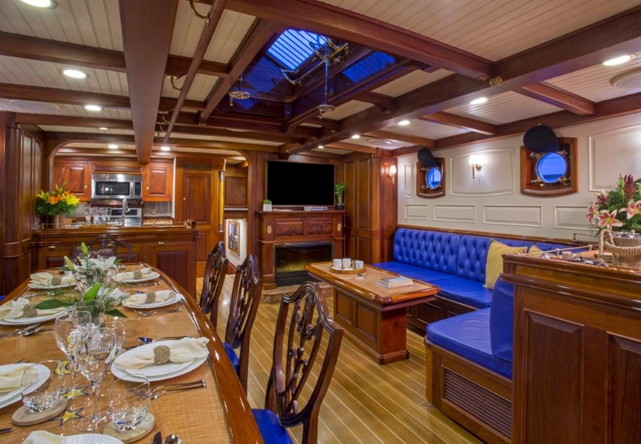 a dining room with a table and chairs aboard COLUMBIA Yacht for Charter
