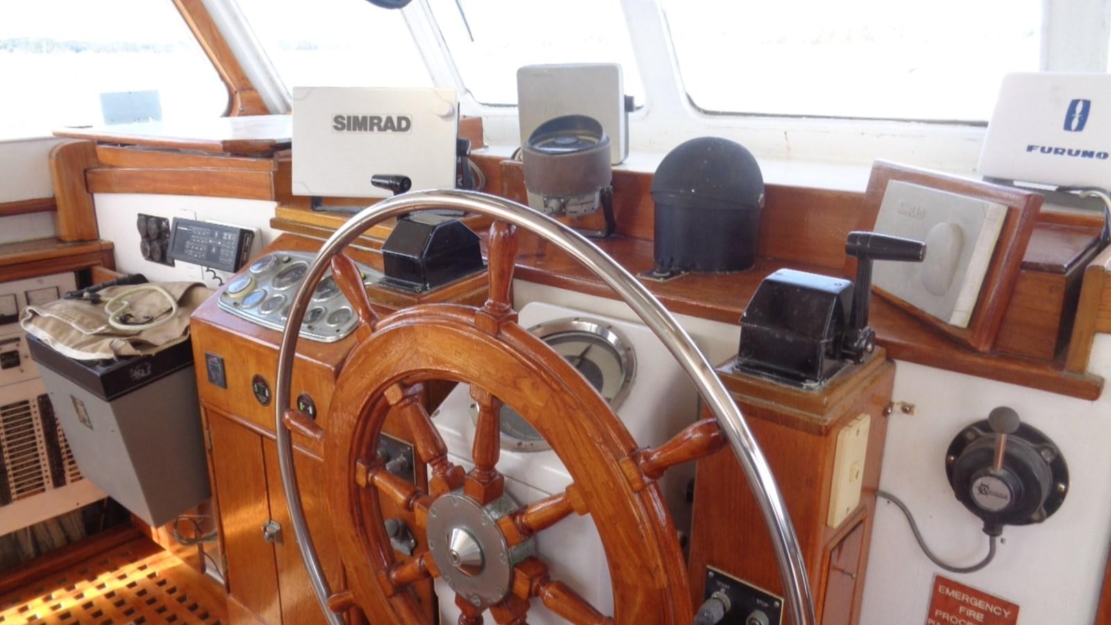 a wooden machine with a large wheel aboard LION'S WHELP Yacht for Sale