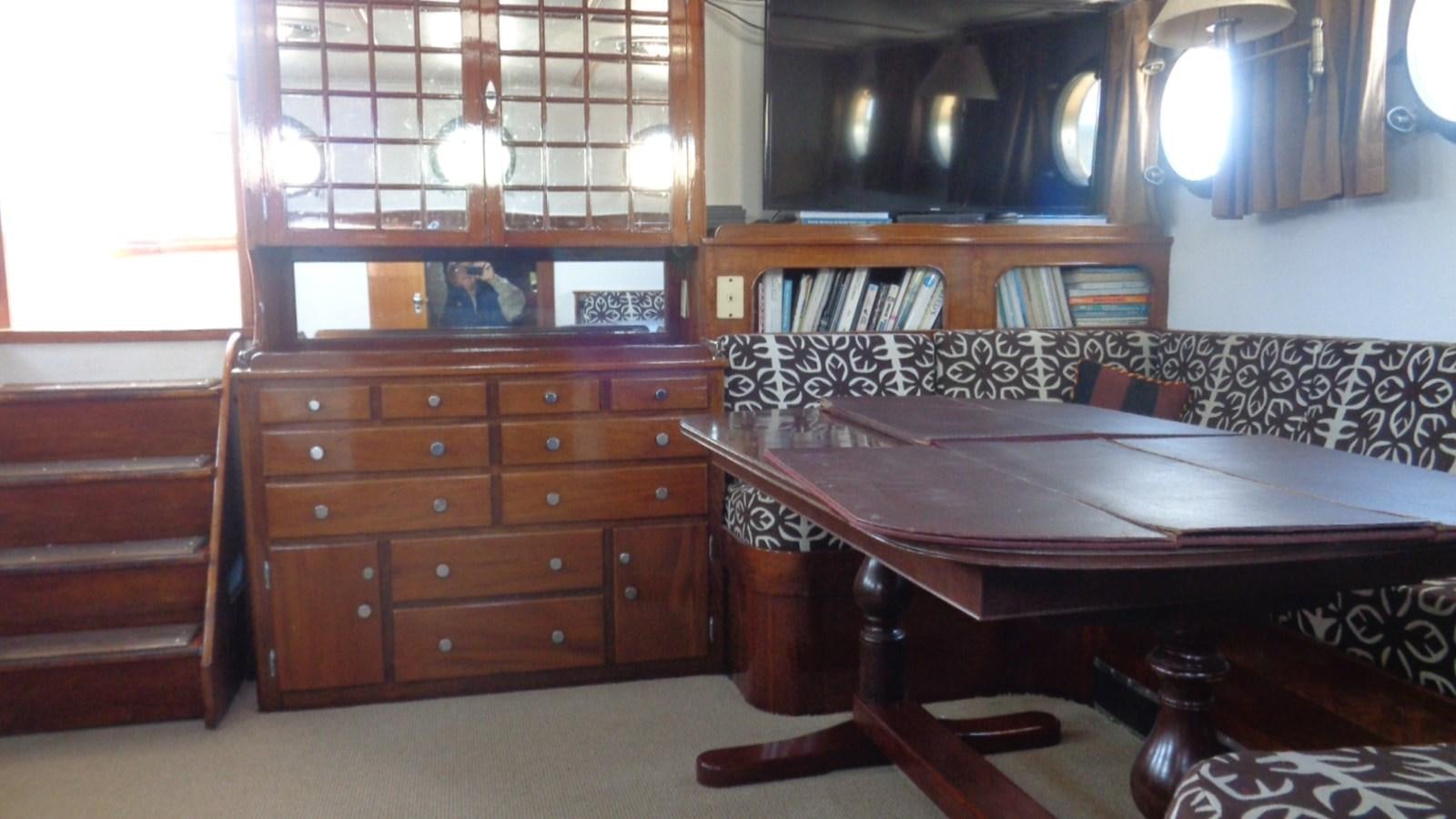 a room with a desk and a bed aboard LION'S WHELP Yacht for Sale