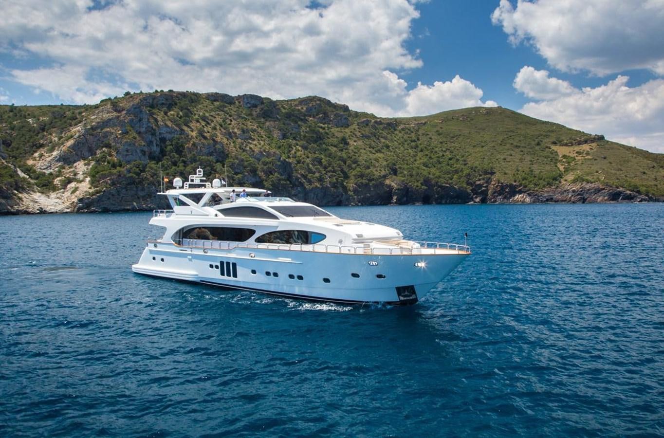 a white yacht in the water aboard MADNESS Yacht for Sale