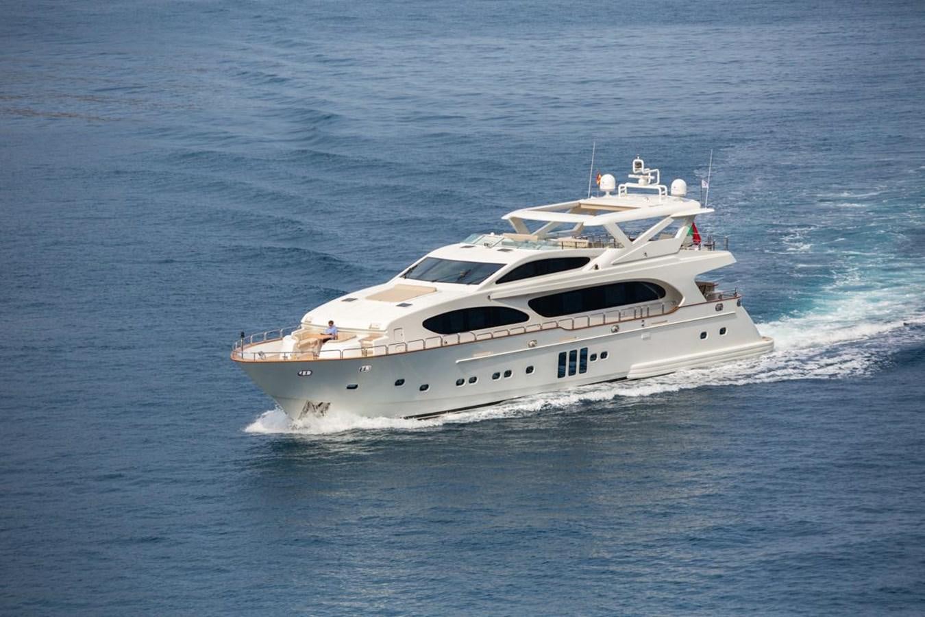 a white yacht on the water aboard MADNESS Yacht for Sale