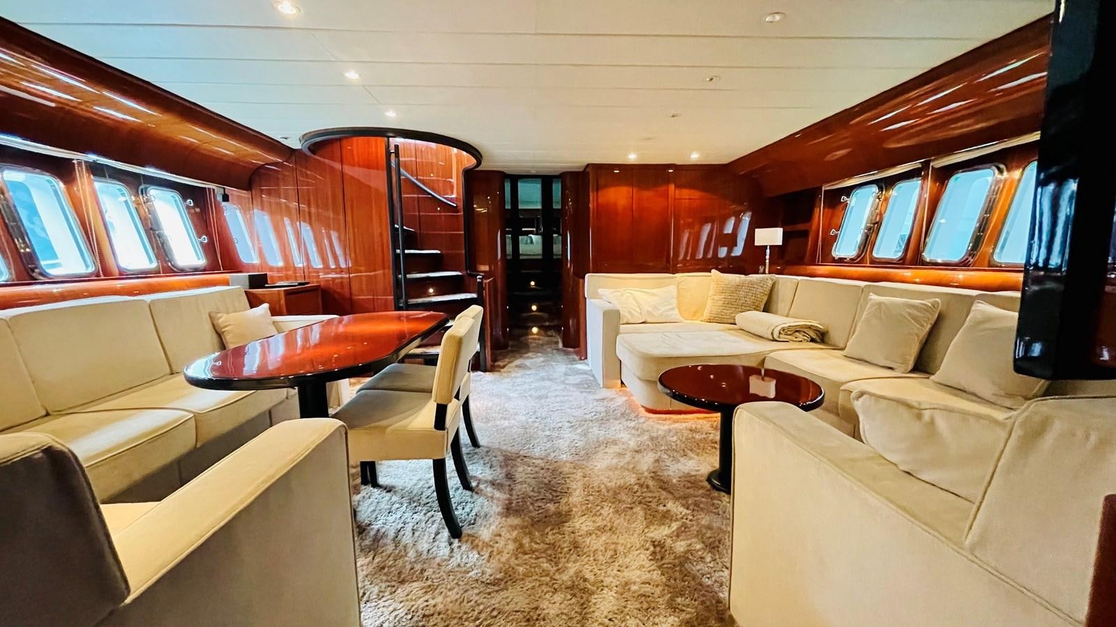 a room with a couch and a table aboard NOTORIOUS Yacht for Sale