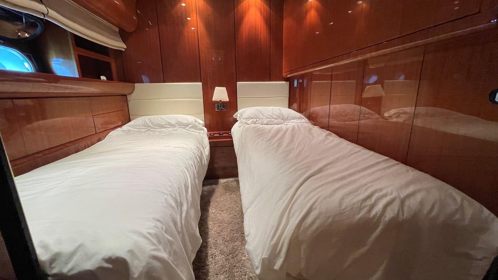 a room with two beds aboard NOTORIOUS Yacht for Sale