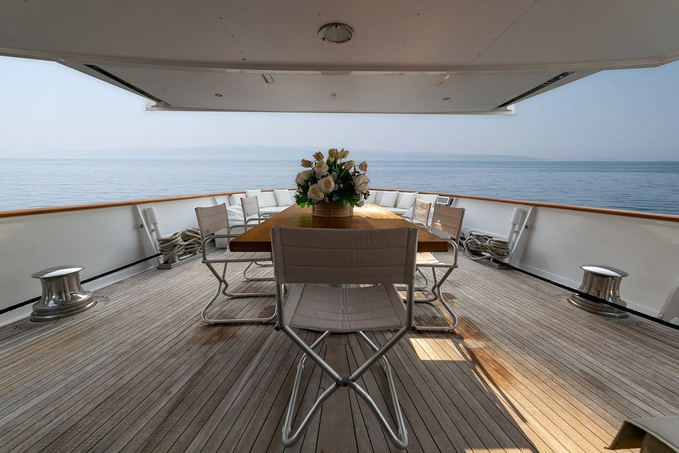 a room with a table and chairs aboard EMERA Yacht for Sale