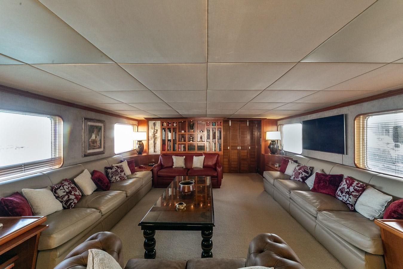 a living room with a couch and a table aboard EMERA Yacht for Sale