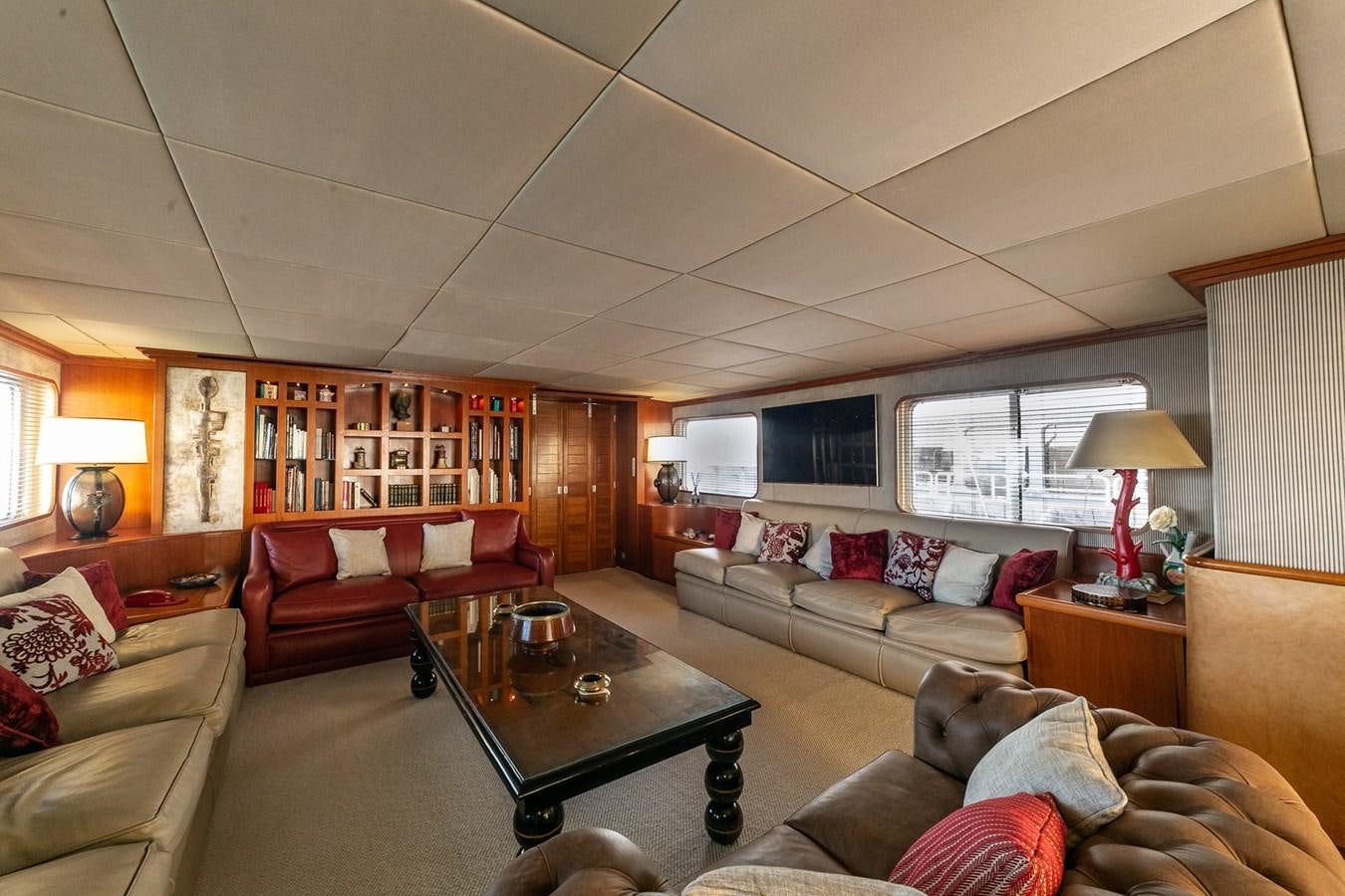 a living room with a couch and a coffee table aboard EMERA Yacht for Sale