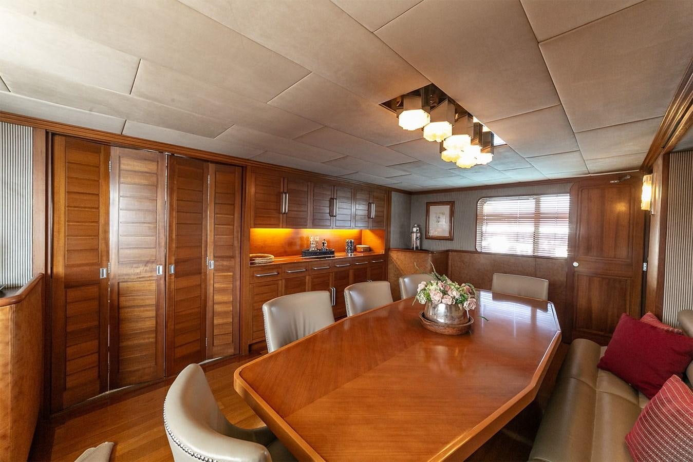 a large kitchen with wooden cabinets aboard EMERA Yacht for Sale