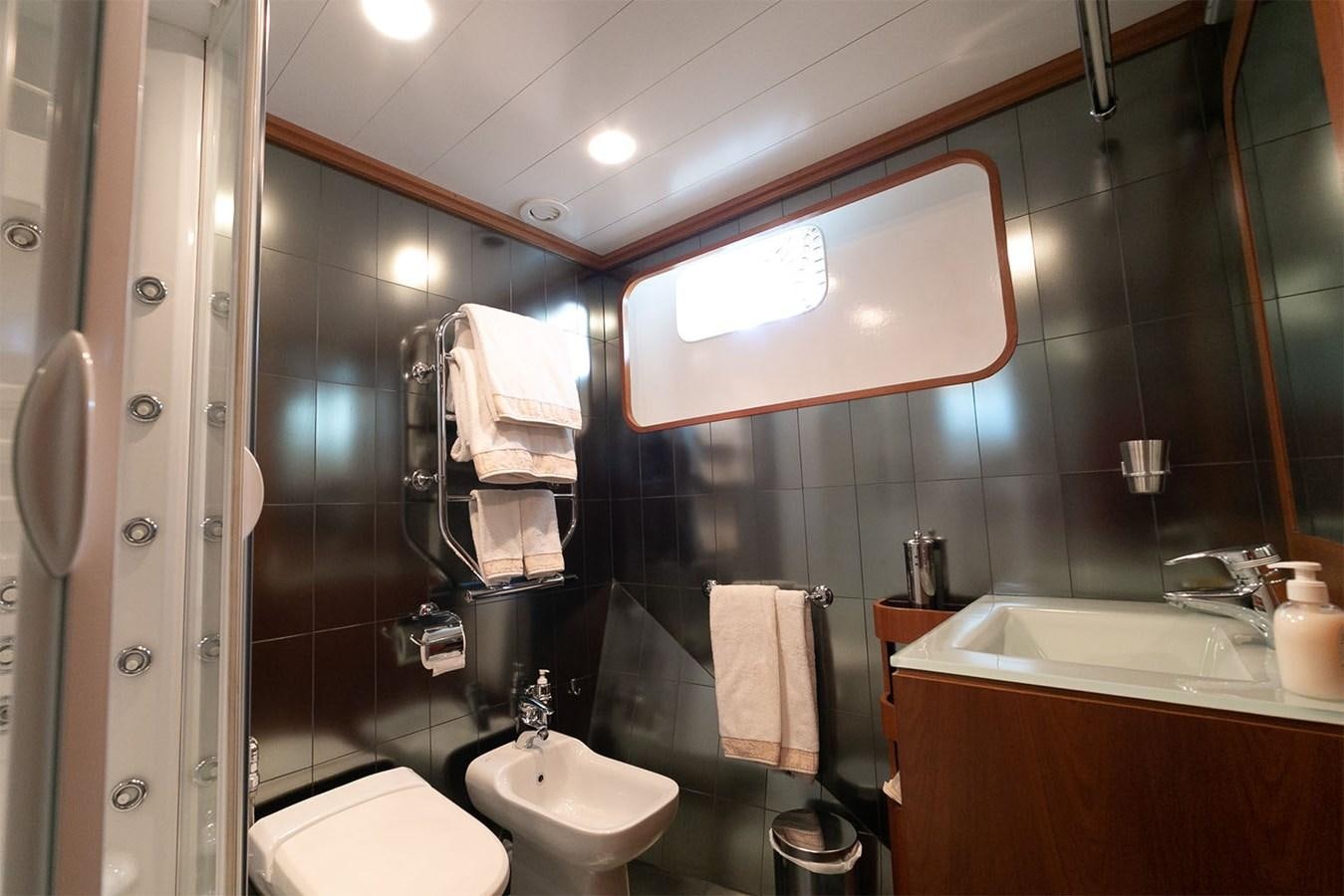 a bathroom with a large mirror aboard EMERA Yacht for Sale
