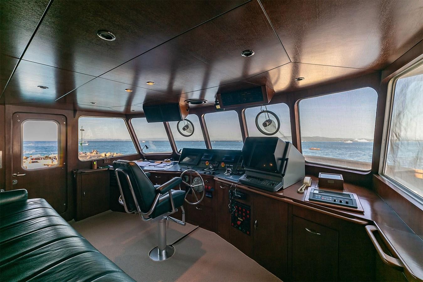 a room with computers and monitors aboard EMERA Yacht for Sale